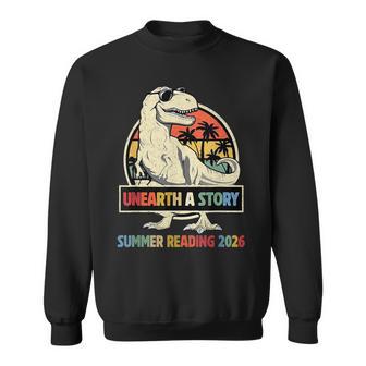 Unearth A Story Summer Reading 2026 Dinosaur Lover Vintage Sweatshirt - Monsterry