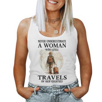 Never Underestimate A Woman Who Still Travels In Her 80'S Women Tank Top - Thegiftio UK