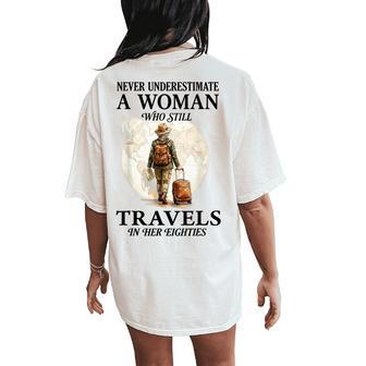 Never Underestimate A Woman Who Still Travels In Her 80'S Women's Oversized Comfort T-Shirt Back Print - Thegiftio UK