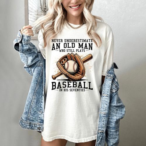 Never Underestimate Old Man Plays Baseball In His Seventies Women's Comfort Colors T-Shirt - Sportilla