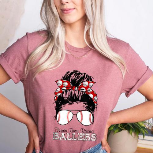 Kinda Busy Raising Ballers Messy Bun Funny Baseball Mom Women's Heather T-Shirt - Sportilla