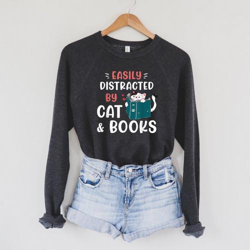 Easily Distracted By Cats And Books Cat & Book Lover For Men Women Kids Raglan Sleeve Sweatshirt - Bookorys