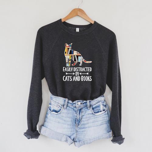Easily Distracted By Cats And Books Reader Cat Lovers For Men Women Girls Kids Raglan Sleeve Sweatshirt - Bookorys AU