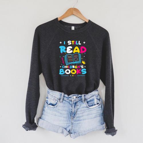 Kindergarten Teacher I Still Read Childrens Books Raglan Sleeve Sweatshirt - Bookorys
