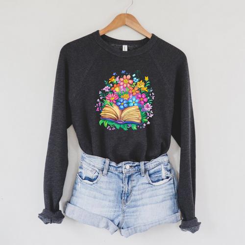 Open Book Surrounded By Colorful Spring Flowers Bloom Raglan Sleeve Sweatshirt - Bookorys