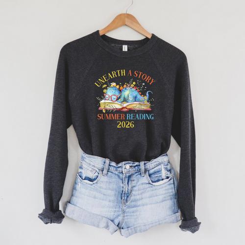 Unearth a Story Summer Reading 2026 Dinosaur Books Dino Raglan Sleeve Sweatshirt - Bookorys CA