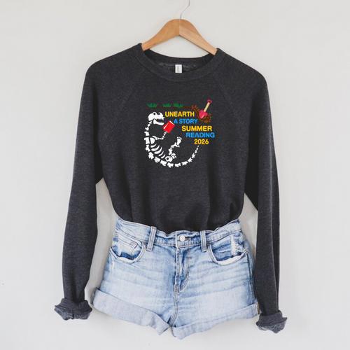 Unearth a Story T-Rex Reading a Book Summer Reading 2026 Raglan Sleeve Sweatshirt - Bookorys