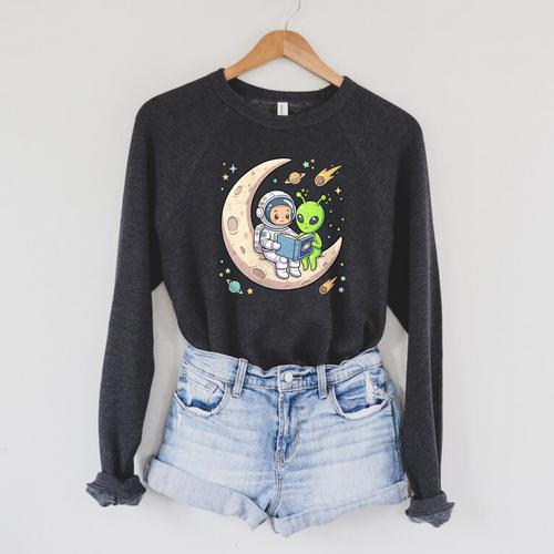 Women's Astronaut Reading Book With Alien Moon Space Astronomy Raglan Sleeve Sweatshirt - Bookorys