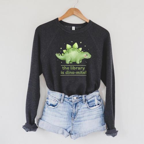Women's The Library Is Dino-Mite Stegosaurus Reading Kids Book Raglan Sleeve Sweatshirt - Bookorys CA