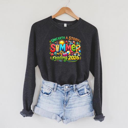 Women's Unearth a Story Summer 2026 Summer Reading Program Book Raglan Sleeve Sweatshirt - Bookorys DE