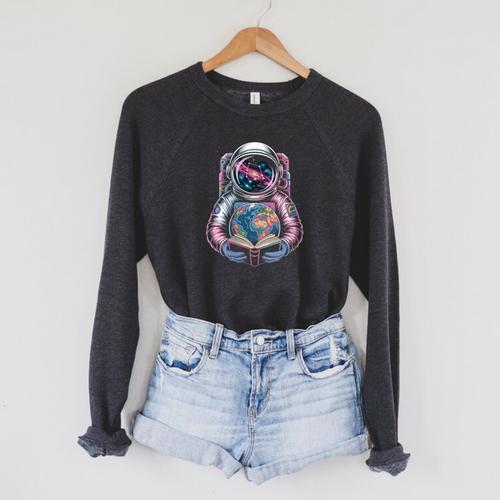 Women's Vintage Astronaut Holding Colorful Books In The Universe Raglan Sleeve Sweatshirt - Bookorys
