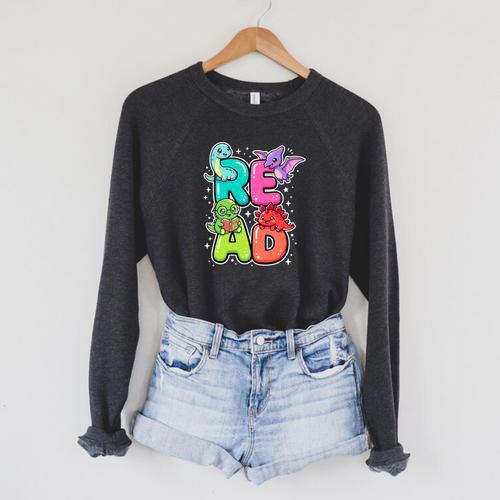 Dinosaur Read Book Lover Dino Reading Kids Premium Tri-Blend Raglan Sleeve Sweatshirt - Bookorys DE