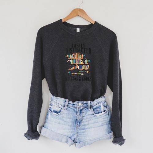 EASILY DISTRACTED BY DRAGONS & BOOKS Medieval Fantasy Reader Raglan Sleeve Sweatshirt - Bookorys AU