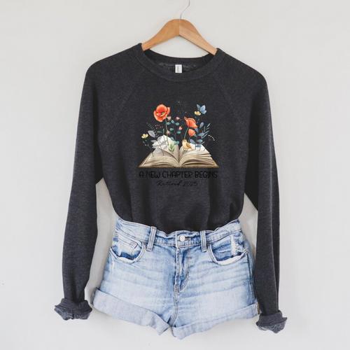 Floral Book A New Chapter Begins Retired Teacher Retirement Raglan Sleeve Sweatshirt - Bookorys AU