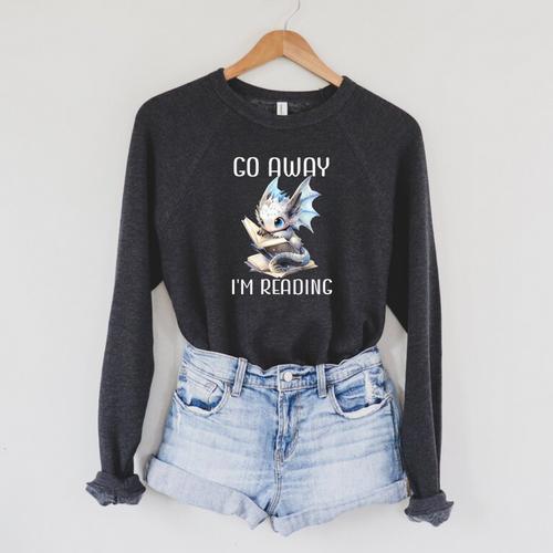 Go Away I'm Reading a Book Dragon Books And Dragons Bookish Premium Tri-Blend Raglan Sleeve Sweatshirt - Bookorys AU