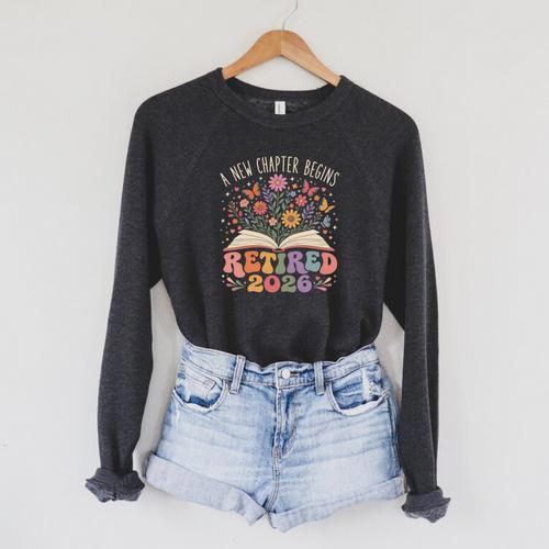 Retired 2026 A New Chapter Begins Floral Book Raglan Sleeve Sweatshirt - Bookorys AU