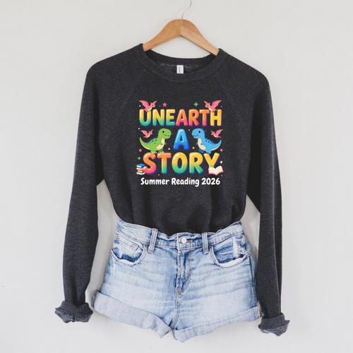 Summer Reading Unearth A Story Dinosaur Books 2026 Raglan Sleeve Sweatshirt - Bookorys CA