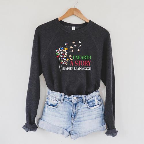 Unearth a Story Summer Reading 2026 Dandelion Books Readers Premium Tri-Blend Raglan Sleeve Sweatshirt - Bookorys