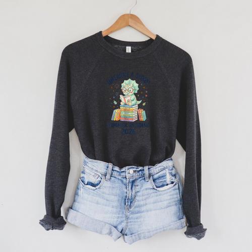Unearth a Story Triceratops Dinosaur Reading Books Cute Dino Raglan Sleeve Sweatshirt - Bookorys