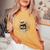 オンバック 5月70日 誕生日 男性 女性 1956年 テディベア レディースオーバーサイズコンフォートTシャツ Mustard