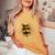 46歳 1980年5月 テディベア 46歳 誕生日 男性 女性 レディースオーバーサイズコンフォートTシャツ Mustard