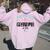 Promoted To Grandma Est 2026 Nana First Time Grandmother '26 レディース オーバーサイズ パーカー バックプリント ライトピンク