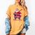 Festive Baseball Bat Costume For Adults And Kids Women's Comfort Colors T-Shirt Mustard Festive Baseball Bat Costume For Adults And Kids Women's Comfort Colors T-Shirt Mustard