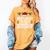 Most Likely To Play Baseball With Santa Christmas Baseball Women's Comfort Colors T-Shirt Mustard Most Likely To Play Baseball With Santa Christmas Baseball Women's Comfort Colors T-Shirt Mustard