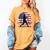Women's Batter Patriotic American Flag Baseball Silks Women's Comfort Colors T-Shirt Mustard