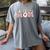 Baseball Mom Bleached Messy Bun Game Day Women's Comfort Colors T-Shirt Gray Baseball Mom Bleached Messy Bun Game Day Women's Comfort Colors T-Shirt Gray