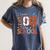 Baseball Football Basketball I Survived 100 Days Of School Women's Comfort Colors T-Shirt Moss Baseball Football Basketball I Survived 100 Days Of School Women's Comfort Colors T-Shirt Moss