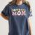 Baseball Mom Bleached Messy Bun Game Day Women's Comfort Colors T-Shirt Moss Baseball Mom Bleached Messy Bun Game Day Women's Comfort Colors T-Shirt Moss