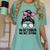 In October We Wear Pink Baseball Mom Messy Bun Breast Cancer Women's Comfort Colors T-Shirt Violet In October We Wear Pink Baseball Mom Messy Bun Breast Cancer Women's Comfort Colors T-Shirt Violet