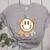 Happy Baseball Mom Groovy Retro Floral Smiling Face Women's Heather T-Shirt Athletic Heather Happy Baseball Mom Groovy Retro Floral Smiling Face Women's Heather T-Shirt Athletic Heather