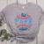 Spring 2024 Season Cute Baseball Mom It Is The Season Women's Heather T-Shirt Athletic Heather Spring 2024 Season Cute Baseball Mom It Is The Season Women's Heather T-Shirt Athletic Heather