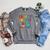 I Believe In You Educational Art With Books And Globe Raglan Sleeve Sweatshirt Deep Heather