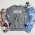 Football Skeleton Reading On Book Stack Raglan Sleeve Sweatshirt Deep Heather