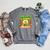 Unearth A Story Dinosaur Summer Reading 2026 Books Raglan Sleeve Sweatshirt Deep Heather