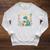 Lost In a Good Book Cute Reading Dinosaur Illustration Raglan Sleeve Sweatshirt Heather Mustard