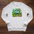 Unearth a Story Library Summer Reading 2026 Dinosaur Book Raglan Sleeve Sweatshirt Heather Mustard
