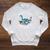 Unearth A Story Summer Reading 2026 Cute Plesiosaurus Book Raglan Sleeve Sweatshirt Heather Mustard Unearth A Story Summer Reading 2026 Cute Plesiosaurus Book Raglan Sleeve Sweatshirt Heather Mustard