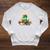 Unearth A Story Summer Reading 2026 Dinosaur Book Floral Raglan Sleeve Sweatshirt Heather Mustard Unearth A Story Summer Reading 2026 Dinosaur Book Floral Raglan Sleeve Sweatshirt Heather Mustard