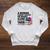 A Woman Cannot Survive On Books Alone She Also Needs Yarn Raglan Sleeve Sweatshirt Heather Mustard A Woman Cannot Survive On Books Alone She Also Needs Yarn Raglan Sleeve Sweatshirt Heather Mustard