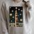 Astrologist Sitting On The Tower Of Stacked Up Books Starry Raglan Sleeve Sweatshirt Heather Forest