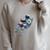 Astronaut Reading Book Sci-Fi Enthusiast Raglan Sleeve Sweatshirt Heather Forest