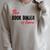 The Book Binder Is Here Raglan Sleeve Sweatshirt Heather Forest The Book Binder Is Here Raglan Sleeve Sweatshirt Heather Forest