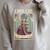 A Book a Day Keeps Reality Away Fairy Reading Tarot Card Raglan Sleeve Sweatshirt Heather Forest A Book a Day Keeps Reality Away Fairy Reading Tarot Card Raglan Sleeve Sweatshirt Heather Forest