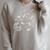 Cute Dandelion Books And School Tools Flower Raglan Sleeve Sweatshirt Heather Forest