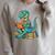 Cute Dinosaur Tales T Rex Reading Books Lover Raglan Sleeve Sweatshirt Heather Forest Cute Dinosaur Tales T Rex Reading Books Lover Raglan Sleeve Sweatshirt Heather Forest