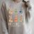 Every Bunny Loves To Read Easter Cute Reading Books Lover Raglan Sleeve Sweatshirt Heather Forest